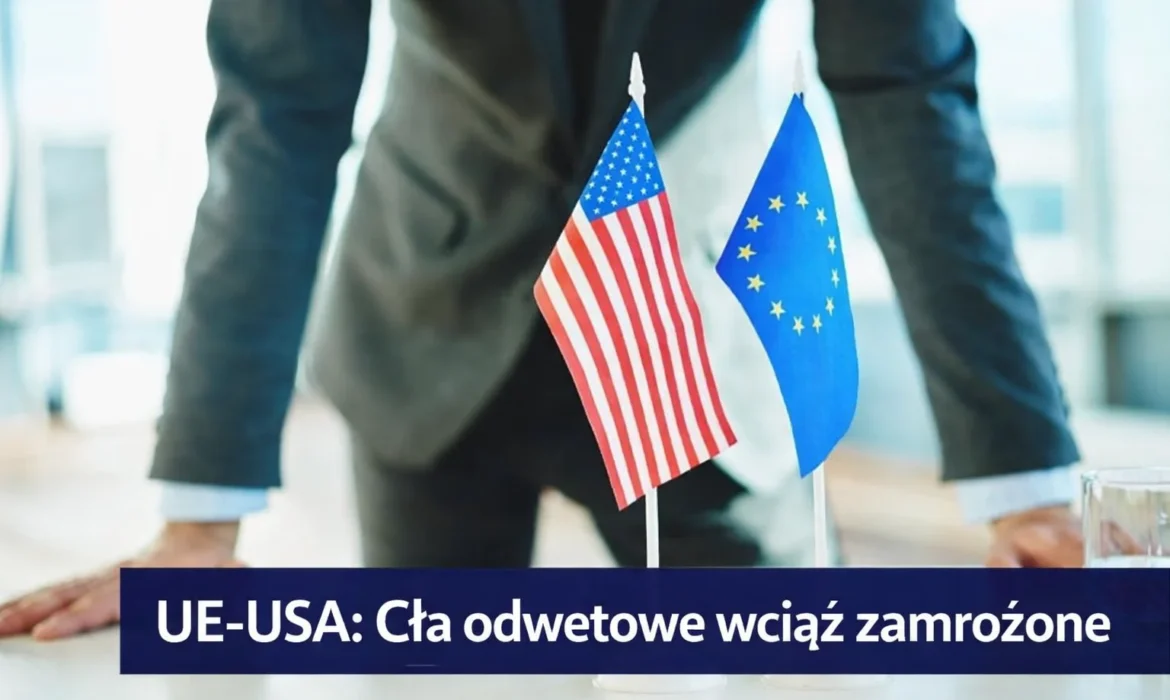 Flagi Unii Europejskiej i Stanów Zjednoczonych symbolizujące relacje handlowe. UE i USA utrzymują zamrożenie ceł odwetowych mimo trwających napięć gospodarczych.